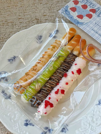 Orange Sweet Finger Biscuit Squishy 4-Pack 🍪 – Matcha, Chocolate & Strawberry Dessert Set